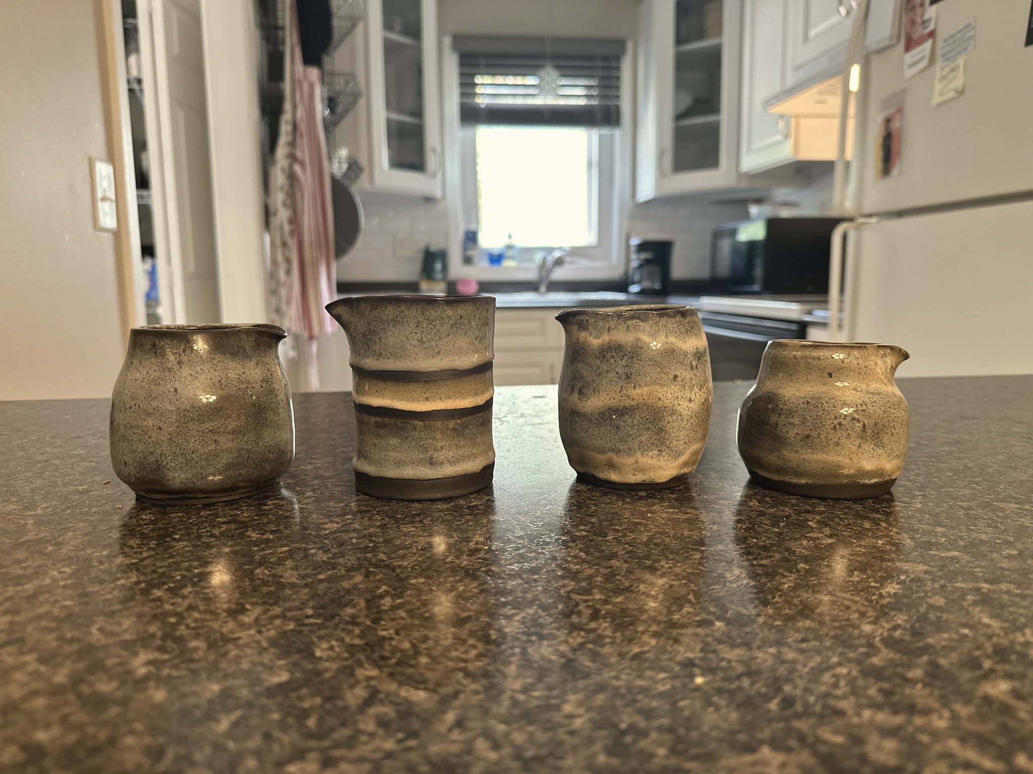 Handmade blue pottery creamers